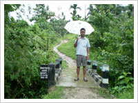 The Villager posing upon the RCC Footbridge over Damittim stream at Gongganggre